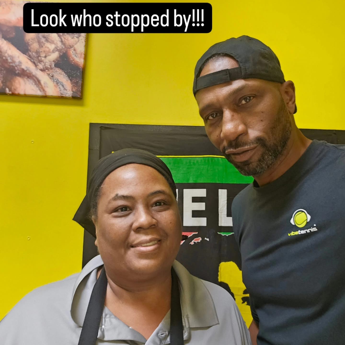 Royal Taste of Jamaica chef with a guest inside the restaurant