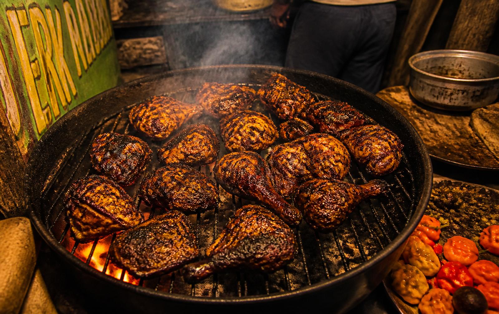 Jerk chicken cooking over charcoal at Royal Taste of Jamaica in Baton Rouge
